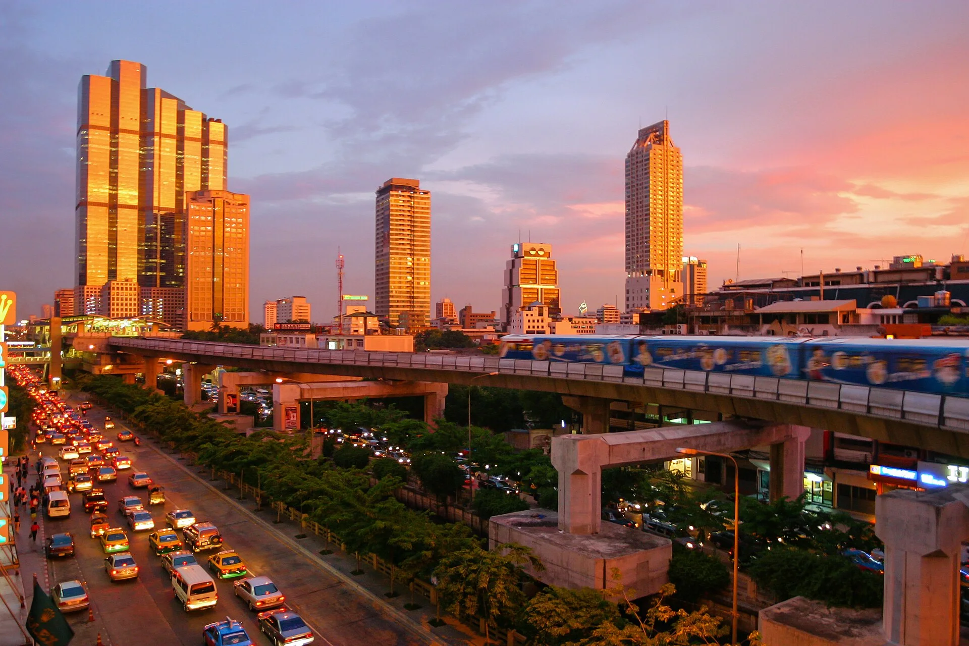 Bangkok skytrain and skyline at sunset along Naradhiwas Rajanagarindra Road